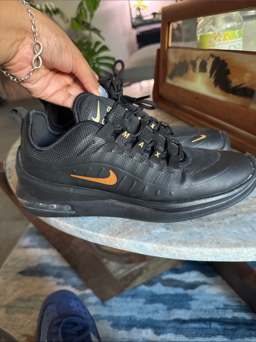 Nike Black Air Max Sneakers with Orange Swoosh Accents